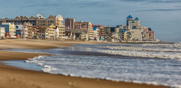 Host An Intimate Gathering At An Ocean City Resort An ocean beach front skyline at sunset